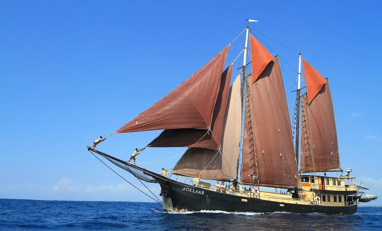 Adelaar liveaboard – schooner underway with sails raised – Indonesia.